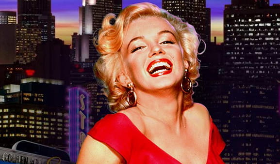 Portada de la slot online Marilyin Monroe de Playtech con su protagonista sonriendo tras un fondo repleto de rascacielos.